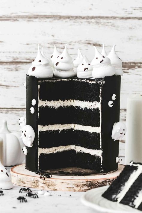 Make this spooky Halloween Ghost Cake with black cake layers and meringue ghosts! Easy to make, fun to decorate, and perfect for Halloween! Halloween Ghost Cake, Meringue Ghosts, Ghost Meringues, Ghost Cake, White Buttercream, Black Cake, Filled Cupcakes, Cake Layers, Chocolate Layer Cake