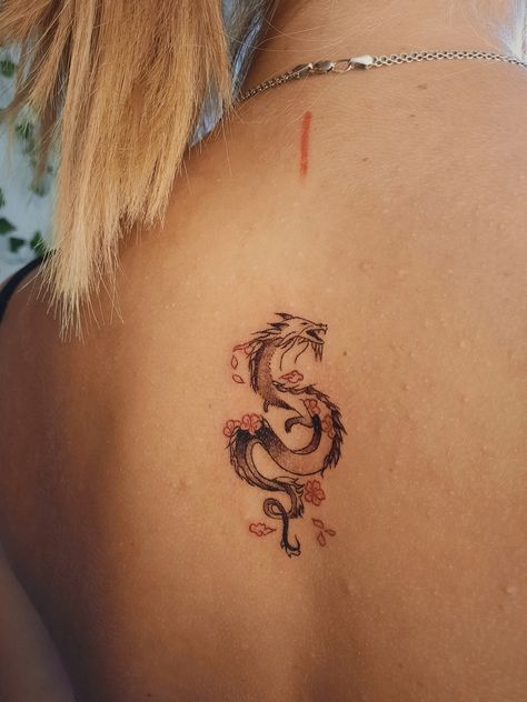 Dragon Tattoo For Women Japanese, Small Dragon With Flowers Tattoo, Dragon Tattoo With Chinese Writing, Magic Tatoos Aesthetic, Small Dragon Back Tattoo, Lower Back Dragon Tattoo, Dragon Finger Tattoo, Fine Line Tattoo Women, Made In China Tattoo