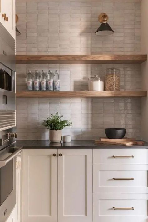 a neutral kitchen with shaker style cabinets, black countertops, a tan Zellige tile backsplash, open shelves and black countertops Backsplash Trends, Black Countertops, Becki Owens, Neutral Kitchen, Kitchen Interior Design, Kitchen Tile, Kitchen Tiles Backsplash, Tile Installation, White Tiles