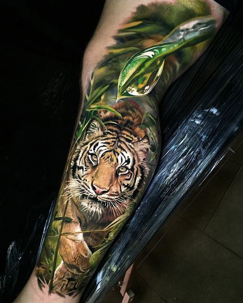 Realistic Tiger in the Jungle | Best tattoo ideas & designs Wild Tiger Tattoo, Mens Tiger Tattoo, Steve Butcher Tattoo, Tato 3d, Tattoo Bunt, Tiger Head Tattoo, Jungle Tattoo, Tatoo 3d, Tiger Tattoo Sleeve