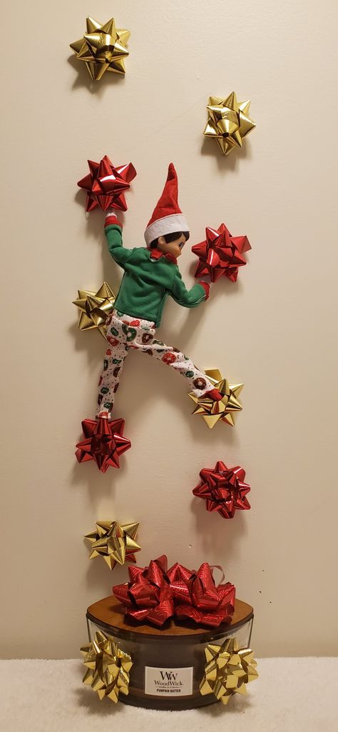 Mark our elf is bow climbing Elf On The Shelf Bow Ideas, Elf Climbing On Bows, Elf On The Shelf Climbing Bows, Elf Trap, Elf Is Back Ideas, Simple Thanksgiving Table Decor, Elf Arrival, Awesome Elf On The Shelf Ideas, Thanksgiving Napkins