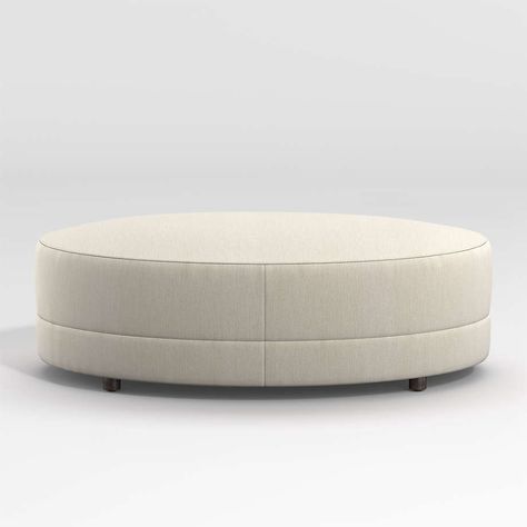 Infiniti Ottoman + Reviews | Crate & Barrel Coffee Table Crate And Barrel, Oval Ottoman, 1930s Hollywood, Leather Cocktail Ottoman, Living Room Decoration Ideas, Room Decoration Ideas, Wicker Coffee Table, Living Tv, Concrete Coffee Table