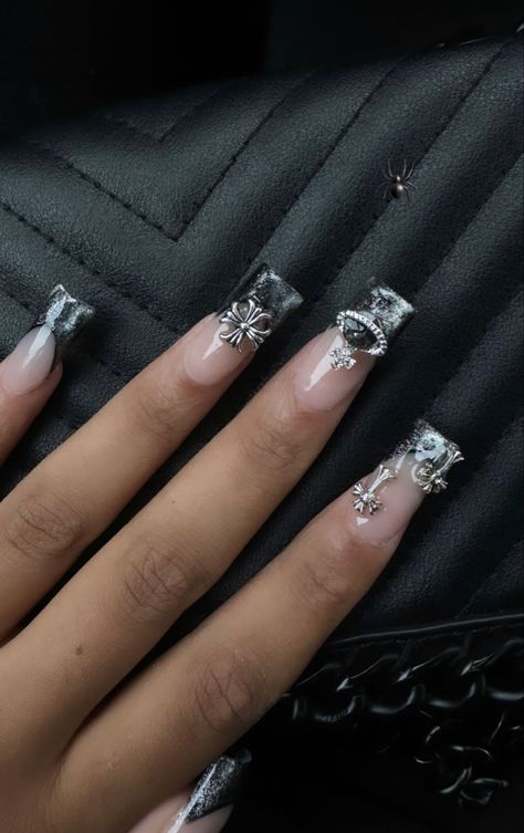 Sliver Nails Design, Silver Acrylic Nails Y2k, Silver Nails With Charms, 14th Birthday Nails, Silver Chrome Cross Nails, Silver Nail Charms, Silver Chrome French Tip Nails With Charms, Black Nails Silver Charms, Nails With Charms