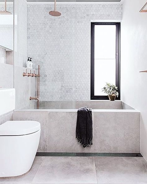 Lovely combination of shower and bathtub. The bath built with large tiles. Hexagon Carrara marble on the wall makes is classy. Brass taps .… | Instagram Toilette Design, Shower Over Bath, Scandinavian Bathroom, Bad Inspiration, Bathroom Windows, Upstairs Bathrooms, Trendy Bathroom, Main Bathroom, Bathroom Inspo