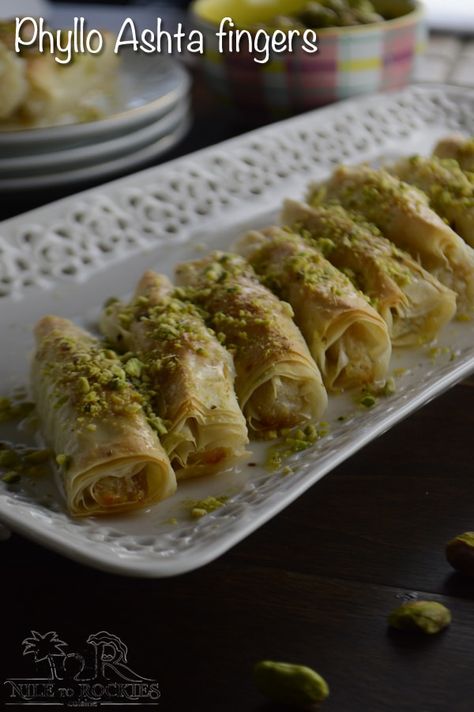 Sweet and soft buttery phyllo dough, wrapped around ashta creamy filling, a delightful Lebanese dessert. Ashta Fingers, Znoud El Sit, Phyllo Dessert, Ramadan Sweets, Phyllo Recipes, Lebanese Desserts, حلويات عربية, Pistachio Baklava, Arabic Desserts