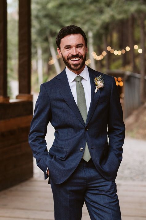 Groom in dark blue suit with olive tie. Mountain wedding elopement at Blackstone Rivers Ranch, Colorado. Captured by Larsen Photo Co, Colorado Elopement Photographer. Groom Suit Dark Blue, Blue Suit With Blue Tie, Groom Suit Spring Wedding, Mountain Elopement Groom Attire, Mountain Wedding Groom Attire, Wedding Suits Groom Blue, Grooms Suits Wedding, Dark Blue Groom Suit, Dark Blue Wedding Suit