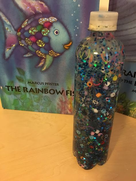 Harmony's House: Rainbow Fish Sensory Bottle Rainbow Fish Sensory Bin, Fish Sensory Bottle, Rainbow Fish Craft Preschool, The Rainbow Fish Activities, Fish Crafts Preschool, When They Come Back, Rainbow Fish Activities, Homeroom Mom, Rainbow Fish Crafts