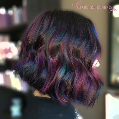 Gorgeous!! "Oil Slick" Balayage. Such a fun color! More multi-tones please!! In this technique I used thick slices to balayage underneath her hair with @colormebykm Up to 7 lightener (with Olaplex) then used 4 custom @Joico vivids (used Magenta, Indigo, Anethyst, Peacock Green, Yellow, Sapphire and Light Purple) all mixed in with @Olaplex step 2. I painted each slice with 2 colors per foil for a more "holographic" or "oil slick" look! Oil Slick Hair, Wild Hair Color, Ombré Hair, Oil Slick, Haircut And Color, Colorful Hair, Rainbow Hair, Hair Envy, Grunge Hair