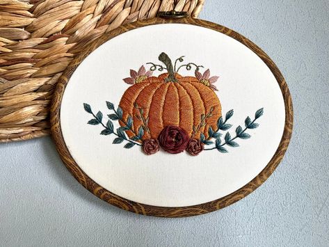 This product is a PDF Digital Download Pattern only - no physical product will be mailed.  This floral pumpkin pattern will fit a 6" round or oval embroidery hoop.  In the download you'll receive a stitch guide, signifying which stitches I used in different parts of the pattern. It also includes a list of materials, tips for getting started and a traceable pattern page.  There are not specific video instructions at this time but I will be filming a stitch along in September where you can stitch each part along with me LIVE or watch the recordings afterwards on YouTube.  FULL KIT coming soon.  This pattern is only for personal use and may not be duplicated or distributed. Jack O Lantern Embroidery, Fall Embroidery Patterns, Oval Embroidery Hoop, Embroidery Hacks, Embroidery Pumpkin, Oval Embroidery, Thread Craft, Fall Embroidery, Pumpkin Embroidery