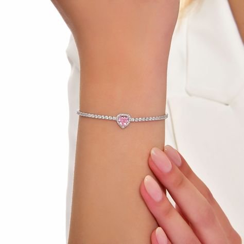 "925 Sterling Silver 4,15 gr - Tolerence) Lenght: 20-21 cm This exquisite silver bracelet features a stunning heart-shaped gemstone in a delicate shade of pink, radiating elegance and charm. Crafted with precision and attention to detail, the heart-shaped gemstone is the centerpiece of this enchanting piece, symbolizing love, affection, and tenderness. Set against a backdrop of polished sterling silver, the soft pink hue of the gemstone captures the essence of romance and femininity. The bracelet's dainty design adds a touch of sophistication to any outfit, making it the perfect accessory for both casual and formal occasions. Whether worn as a statement piece or layered with other bracelets, this pink color heart shape gemstone silver bracelet is sure to evoke admiration and admiration whe Dainty Jewelry Bracelets, Pink Heart Bracelet, Rose Love, Silver Heart Bracelet, Minimalist Bracelet, Amethyst Bracelet, Pink Gemstones, Pink Amethyst, Bracelet Argent