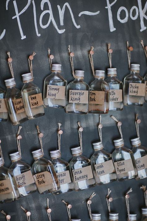 Drinks bottle table plan with brown name tags on each bottle Table Seating Bottles, Lampshade Decor, Boho Lampshade, Wedding Scroll, Rue De Seine Bridal, Rock N Roll Wedding, Diy Wedding Inspiration, Wedding Signs Diy, Drinks Bottle