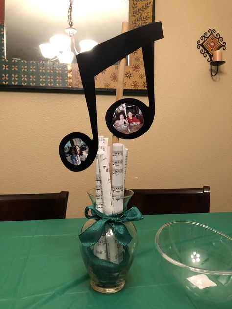 Old music copies & extra vase Music Inspired Centerpieces, Music Themed Graduation Party, Music Centerpieces Ideas, Music Note Centerpieces, Graduation Display Table, 60th Birthday Theme, Music Centerpieces, Graduation Display, Old Man Birthday