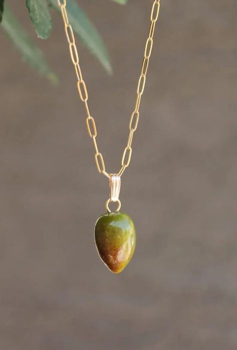 These handmade olives are amazingly realistic! They just look like the real ones in size and colors. These beads are carefully crafted from Italian glass. They are about 14 mm/.55. Single charm only can be purchase. Bail is 7.3 x 2.4 mm Metal: sterling silver 14k gold filled Chain can be customized. #olive #olivegreen #black #necklace #charm #murano #glass Olive Necklace, Pomegranate Earrings, Single Bead, Group Gifts, Olive Trees, Olive Fruit, Green Olive, Intellectual Property, Olive Color