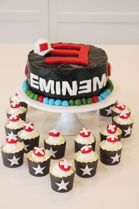 Eminem themed cake for a Gangsters and Rappers 21st party. Used the official Eminem font for the name and Eminem cross symbol for the cupcakes Eminem Cupcakes, Eminem Birthday Party Ideas, Eminem Themed Party, Eminem Birthday Party, Eminem Birthday Cake, Eminem Cake, Eminem Birthday, Cake Themes, Cupcake Business