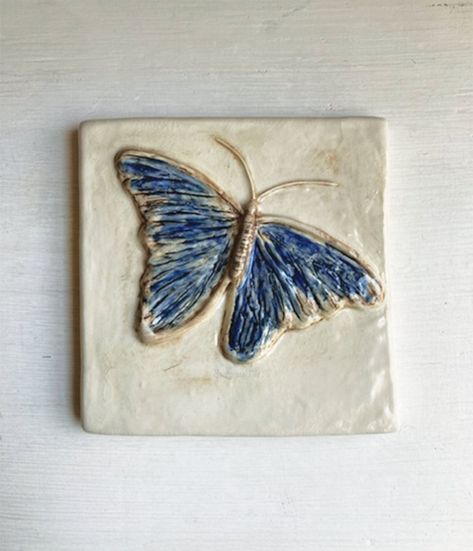 Butterfly Ceramic Tile  (hand painted) Enjoy this Butterfly art tile inspired by the elegance of the butterfly.  Each ceramic tile is individually handmade in fine porcelain clay and hand painted using underglaze and glaze. Similar to a painting each tile is an original. (You will receive the tile shown in the listing.)  All tiles are made by me and I hope they bring a bit of charm & happiness to you. Enjoy the beauty of the butterfly! Details: This clay tile is approximately 6" across and 6 hig Clay Tile Ideas Ceramic Art, Slab Relief Ideas, Butterfly Ceramics Ideas, Low Relief Sculpture Clay, Tile Painting Ideas Art, Ceramic Slabs Tiles, Ceramics Wall Art, Clay Tiles Designs, Clay Tile Art