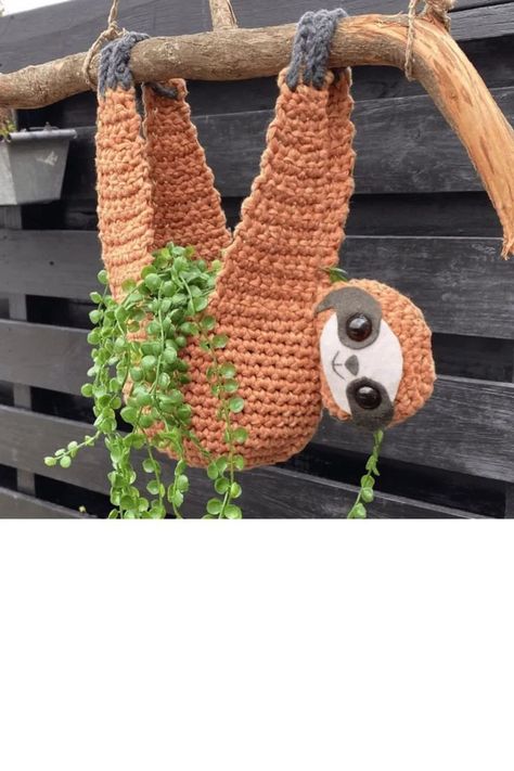 🧶 Dive into handcrafted elegance with this crochet plant hanger pattern! 🌟 Elevate your indoor garden and bring sophistication to your space. Whether you're a crochet enthusiast or just starting, this pattern offers a graceful way to showcase your plants. Embrace creativity, add a touch of handmade charm, and watch your greenery flourish! 🌺✨ #CrochetPatterns #HandmadeDecor #PlantHangers #DIYCrafts #IndoorGreenery #ElegantHome #CreativeCrochet #CraftingInspiration Crocheted Plant Hangers Free Patterns, Free Sloth Planter Crochet Pattern, Crochet Sloth Hanging Planter, Sloth Plant Hanger Crochet Pattern, Sloth Crochet Plant Holder Free Pattern, Crochet Hanging Sloth Planter Free Pattern, Sloth Crochet Plant Holder, Crochet Sloth Plant Hanger Pattern, Sloth Planter Crochet Pattern