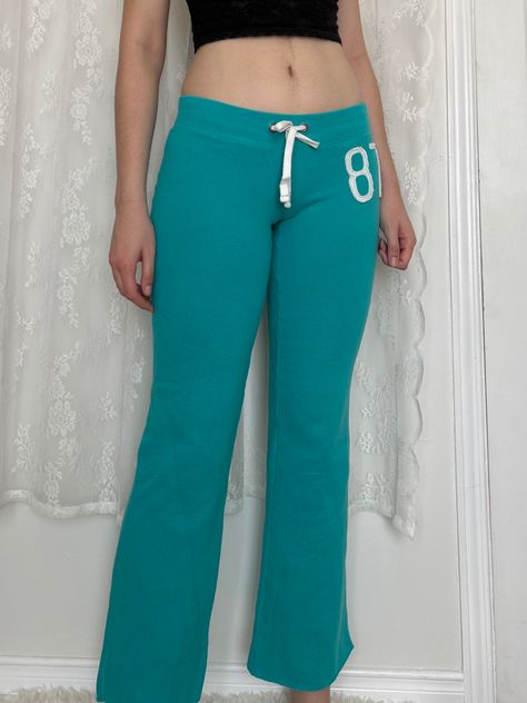 Low Rise Tracksuit, Teal Aesthetic Outfit, Low Rise Sweatpants Outfit, Y2k Low Rise Jeans Outfit, Teal Pants Outfit, Flare Sweat Pants, Aeropostale 2000s, Aeropostale Outfits, Low Rise Jeans Outfit