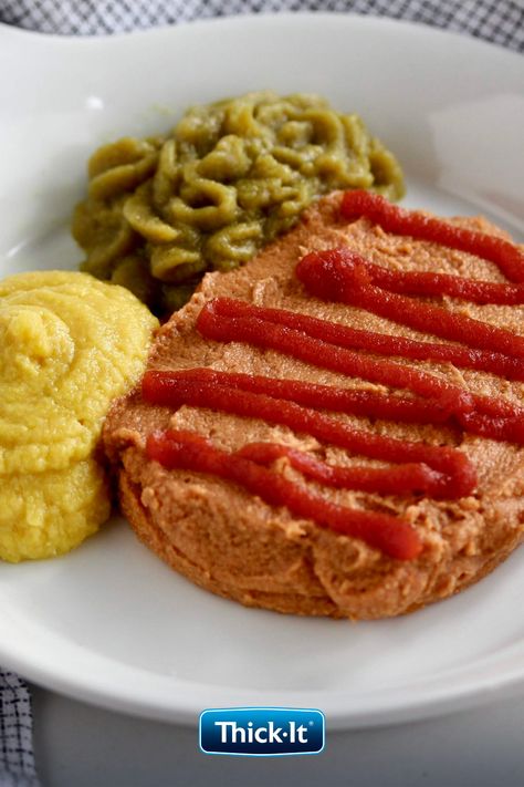 Pur�éed meatloaf with red ketchup, puréed green beans, and puréed sweet corn on a white dish with a checkered napkin background Pureed Recipes, Dysphagia Diet, Pureed Diet, Seasoned Green Beans, Pureed Food, Meatloaf Mix, Soft Foods Diet, Traditional Meatloaf, Classic Meatloaf Recipe