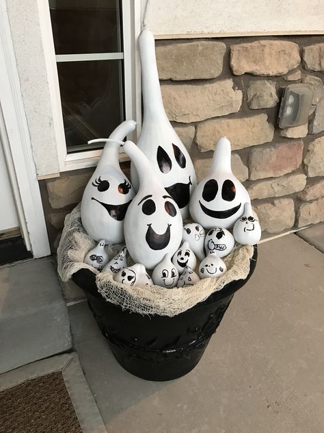 Gourd ghosts. I had a ton of extra gourds from my garden, so I spray painted them with flat white paint and the kids and I added faces with black sharpie. Ghost Gourd Painting, Diy Painting Gords, Painted Ghost Gourds, Fall Painted Gourds, Crafts With Gourds, Gourd Bowls Ideas, Painted Gourds Ideas Halloween, Gourd Painting Ideas Halloween, Halloween Painted Gourds