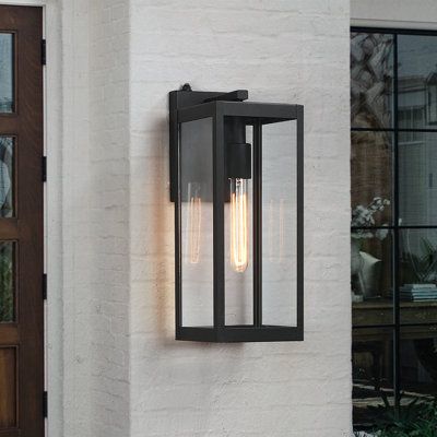 16.5" outdoor wall lantern sconce light fixture, it's a contemporary beauty yet functional—powder-coated black finish. This ambient outdoor sconce lighting is a decorative wall-mounted fixture that provides a beautiful light for an entryway, doorway, foyer, corridor, balcony, patio, and porch. It features a dusk-to-dawn auto sensor which enables the fixture to turn on at dusk and turn off at dawn automatically | 17 Stories 16.5" H Outdoor Wall Lantern w / Dusk to Dawn Glass / Metal in Black | 16 Front Door Lighting, Outdoor Wall Light Fixtures, Wall Mount Lantern, Modern Outdoor Wall Lighting, Black Outdoor Wall Lights, Led Outdoor Wall Lights, Garage Lighting, Luminaire Mural, Outdoor Sconces