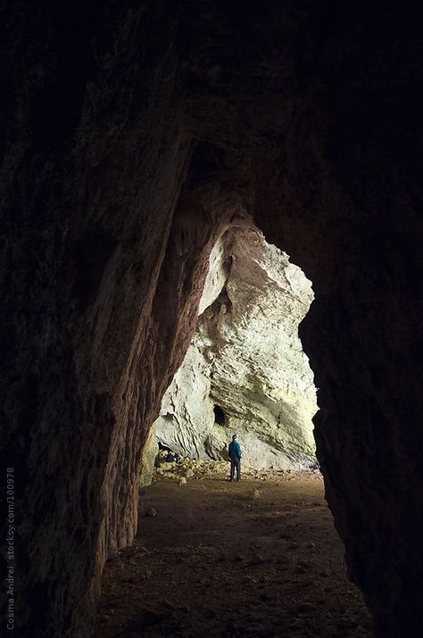 Cave entrance with man standing inside light on Stocksy United Banana Wars, A Passage To India, Cave Entrance, Movie Script, Religious Symbols, Man Standing, Walk Out, Art References, Stock Photography