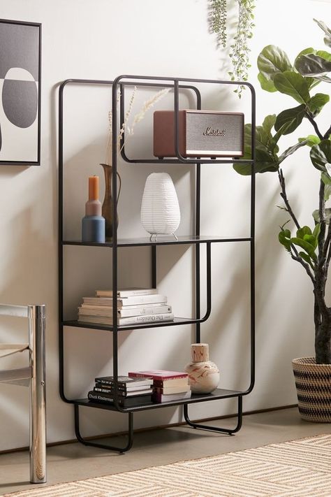 A modular metal bookshelf groovy enough to store your vinyl collection, vintage books, and potted vines. Alana Bookshelf, Urban Balcony, Diy Bookshelves, Minimalist Bookshelves, Black Bookshelf, 60s Decor, Large Bookshelves, Metal Bookshelf, Modern Bookshelf