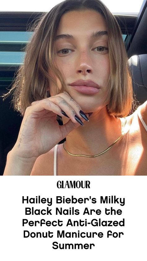 Though Hailey Bieber sported black glazed donut nails back in October, breaking out this milky version of the shade out during the summer feels like a particularly stark departure from her favored dainty manicure, further signaling the end of her neutral chrome era. Earlier this month, Bieber experimented with a colorful set of mismatched pattern nails before pairing her Barbiecore mirrorball dress with a bright red polish with pink French tips. Sometimes it's good to switch things up. Black Donut Glaze Nails, Black Hailey Bieber Nails, Black Glazed Donut Nails, Hailey Bieber Black Nails, Red Glazed Donut Nails, Milky Black Nails, Black Glazed Nails, Hailey Bieber Glazed Doughnut Nails, Hayley Bieber Glazed Donut Nails