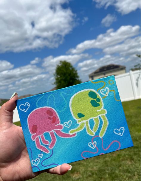 I used paint markers for the jellyfish and arylic paint for the background !:3 Spongebob Jellyfish Painting Canvas, Cute Drawings And Paintings, Sponge Bob Jelly Fish Painting, Painting Ideas On Canvas Paint Markers, Cute Fun Painting Ideas, Spongebob Posca Art, Things To Paint For Friends, Drawings With Paint Markers, Spongebob Love Painting