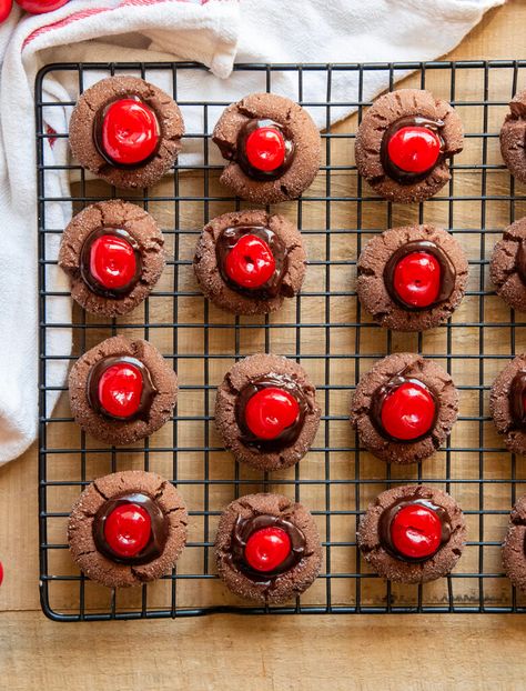 These Chocolate Cherry Thumbprint Cookies taste like a chocolate covered cherry in cookie form. They've got a soft chocolate cookie, topped with a smooth and rich chocolate ganache, and a maraschino cherry. Perfect for chocolate cherry lovers! Chocolate Cherry Thumbprint Cookies, Cherry Thumbprint Cookies, Oatmeal Lace Cookies, Soft Chocolate Cookie, Drop Sugar Cookies, Chocolate Cherry Cookies, Chocolate Covered Cherry, Christmas Baking Cookies, Best Christmas Desserts