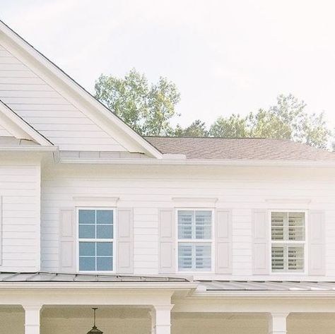 Farmhouse Is My Style on Instagram: "Glorious summer sun on a classic white farmhouse with a beautiful brick patio, soft grey window shutters, double front doors and a pretty lantern light. A picture of perfection. (Photo Credit: @case.rutherford & @heather_carraway) 💞🏡🌳🌾🚜🐓💛🧡🌿🌼 •• Best Voted Farmhouse Bags, Wallets, T-Shirts & Shoes!! ☕🧡👜 Shop Now ➡️ ➡️ @farmhouseismystyle •• #farmhouselifestyle #farmhousefarmersmarket #farmhousehomedesigns #farmhouseinspireddecor #farmhouseporches # Silver Roof Farmhouse, White House Light Gray Shutters, White Farmhouse Gray Shutters, White Farmhouse Brown Shutters, White Farmhouse With Garage, Classic White Farmhouse, Farmhouse Porches, Southern Cocktail, Farmhouse Lifestyle