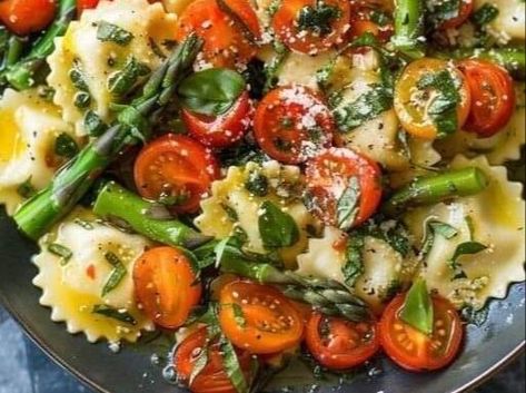 Quick and Easy Ravioli with Asparagus, Tomatoes, and Garlic Herb Sauce Recipe! - NewsBreak Garlic Herb Sauce Recipe, Ravioli With Asparagus, Crisp Asparagus, Garlic Herb Sauce, Hamburger Potato Soup, Easy Ravioli, Asparagus Garlic, Satisfying Meals, Ravioli Recipe