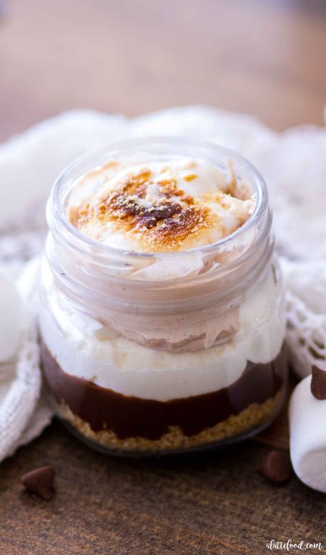 These No Bake S’mores Trifles are a fun twist on the classic summer dessert! These easy s’mores trifles are layers of graham cracker crust, milk chocolate ganache, marshmallow cream filling, and chocolate cream. They are creamy, dreamy, and oh-so-decadent! This No Bake S’mores Trifle recipe is one of my favorite easy summer desserts!  Raise yourcontinue reading ... Marshmallow Cream Filling, Baked Smores, Pizza Sugar Cookie, Mason Jar Desserts, Milk Chocolate Ganache, Homemade Recipes Dessert, Trifle Desserts, Dessert In A Jar, Marshmallow Cream