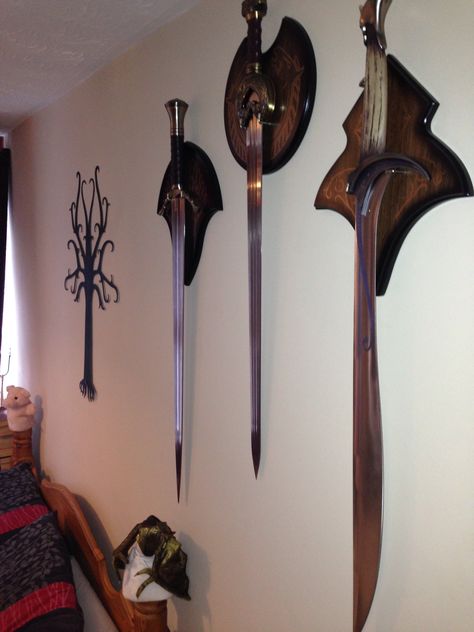 LOTR Swords Display Swords On Wall, Masculine House, Lotr Swords, Dnd Room, Tree Of Gondor, Bee Room, Goth Home, Wood Shop Projects, Wall Racks