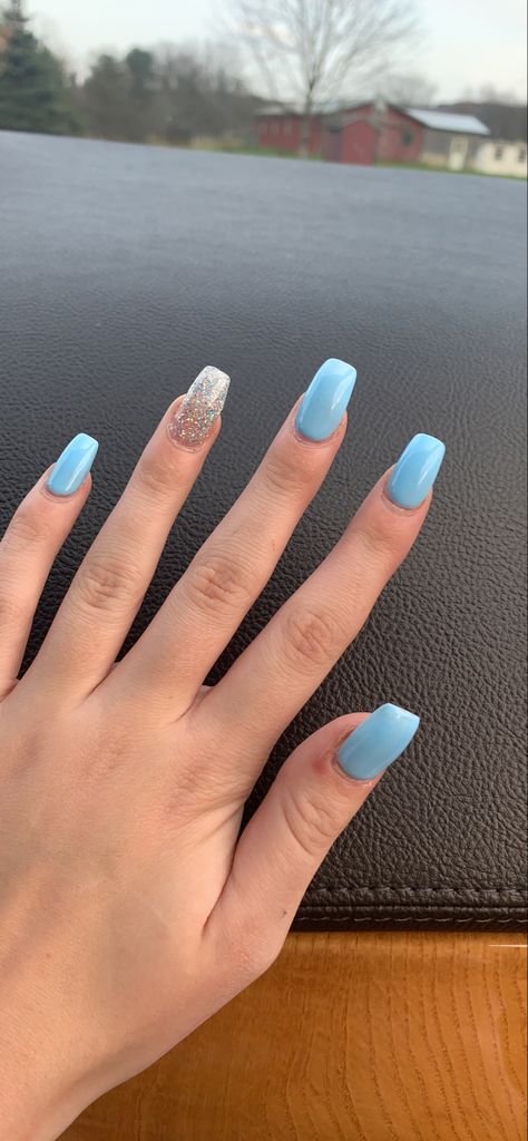 Blue And Sparkle Acrylic Nails, Blue Shirt Acrylic Nails, Almond Shape Light Blue Nails, Cute Light Blue Nail Ideas, Cinderella Blue Nails For Prom, Acrylic Nails For Prom Blue Dress, Aquamarine Nails Acrylic Short, Sky Blue Nails With Glitter, Blue Nails With Ring Finger Design