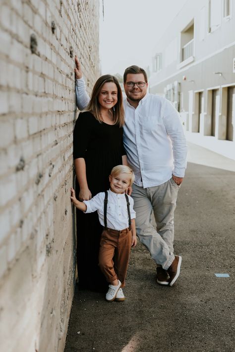 Family Photo Shoot Downtown, Family Photo Outfits Downtown, Main Street Family Photos, Brick Family Photos, Family Pics Downtown, Family Photos Downtown Picture Ideas, Downtown Family Pictures, Downtown Family Of 3 Photoshoot, Family Photos Brick Wall