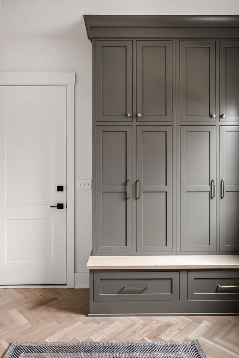 Custom Cabinetry makes every room better. It's not just ideal for the kitchen and bathroom but for high-traffic areas like your mudroom. We designed these cabinets to give the client plenty of storage above and below - Keeping all their seasonal stuff in one place. Interested in custom cabinets? Contact us today! #customcabinets #mudroomdesigns #homearchitecture #homesweethome #customhomeideas Built In Lockers Mud Rooms, Lockers In Mudroom, Hallway Built In Cabinets, Mudroom Cabinetry, Modern Craftsman Home, Built In Lockers, Mudroom Closet, Mudroom Remodel, Floor To Ceiling Cabinets