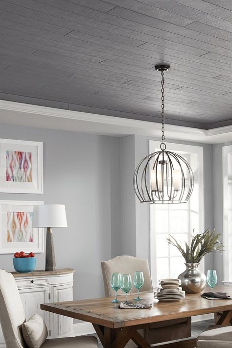 New ceilings colors and textures abound in this dining room featuring WOODHAVEN Woven in Charcoal Gray.  Installed in a tray ceiling, this shiplap/wood look ceiling is the focal point of this beautiful dining area. Want more ceiling ideas? Get them from your friends at Armstrong Ceilings! #armstrongceilings #ceilingideas #woodceilings #dining Tray Ceiling Ideas, Ceiling Ideas Living Room, Shiplap Wood, Dark Ceiling, Grey Ceiling, Shiplap Ceiling, Armstrong Ceiling, Plank Ceiling, Grey Dining Room