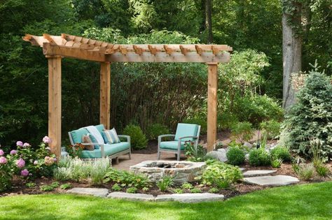 Stone pie shaped wood-burning fire pit in the corner of a small garden patio. Corner Pergola, Small Pergola, Small Courtyard Gardens, Patio Pergola, Courtyard Gardens Design, Small Patio Garden, Outdoor Seating Area, Pergola Design, Patio Fire Pit