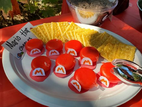 Mario Party Appetizers, Super Mario Pretzels, Mario Kart Food Ideas, Mario Pretzel Rods, Mario Candy Kabobs, Yoshi Eggs Mario Party, Mario Day, Mario Hat, Princess Peach Party