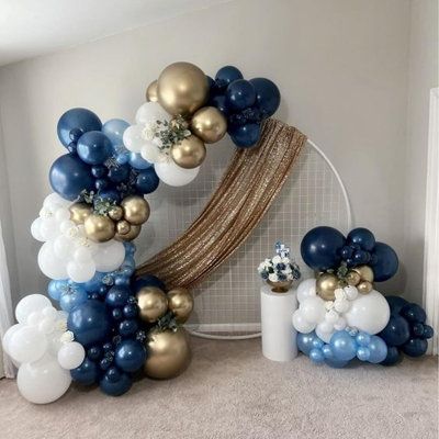 12 Inch Navy Blue Gold Balloons Set: 8 x pearl white, 5 x metallic gold balloons, 12 x pearl midnight blue, 5 x metallic blue, 5 x blue confetti , with 1 x 10-meter white ribbon included in this vibrant balloon set. Ideal for men’s and boys' birthdays, baby showers, graduations, and other special celebrations, adding a royal and elegant touch to any event. Premium Balloons: These navy blue, gold, and white balloons bring together classic elegance and vibrant color. With no strong odors, they ar… White Blue And Gold Balloon Arch, House Party Balloon Decorations, Navy And Gold Balloon Garland, Navy And Gold Banquet Decorations, Navy Blue Balloon Decor, Navy Blue Party Decorations For Men, Midnight Centerpieces, Blue And Gold Balloons Decoration, Navy Blue Event Decor