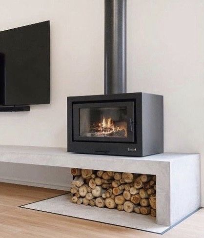 Woodburner Tv Wall, Fireplace On Concrete Bench, Log Burner Tv Wall Modern, Living Room Stove Fireplace, Small Indoor Fireplace, Living Room Tv Area Designs, Wood Stove And Tv Wall, Living Room With Freestanding Fireplace, Wood Stove And Tv Placement