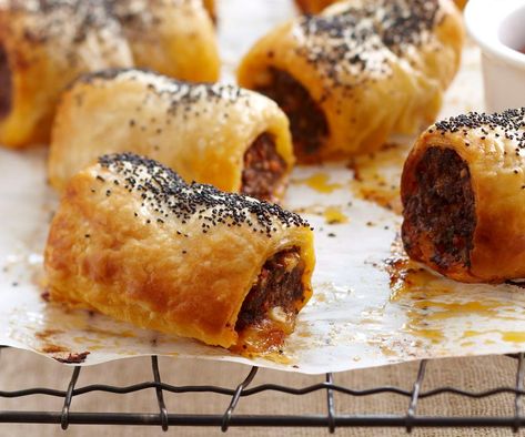 Your guests will be reaching for more with this gourmet version of classic sausage rolls. Crunchy, golden pastry compliments the tender lamb filling just begging to be dipped in tomato sauce and gobbled up. Cheese And Bacon Sausage Rolls, Chicken Sausage Rolls, Lamb Sausage, Homemade Sausage Rolls, Sausage Rolls Recipe, Spiced Lamb, Savoury Pies, Vegetarian Sausages, Sausage Roll