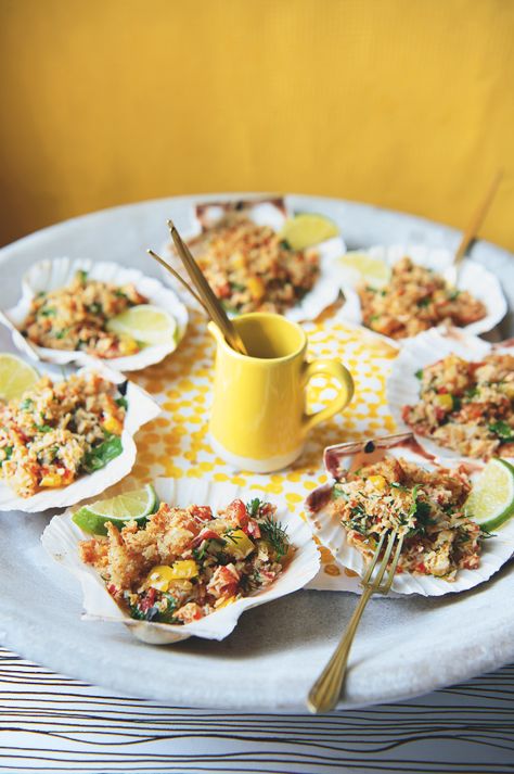 Scallop shells are the ideal vessel on which to serve these decadent canapés, in a zesty homage to the bounteous British coast. Pair with a delicate Italian chardonnay blend to cleanse and refresh the palate. Crab Starter Recipes, Elegant Food Recipes, Calamari Dishes, Crab Starter, Scallops Appetizer, Coconut Food, Famous Cartoon Characters, Chilli Crab, Seafood Gumbo