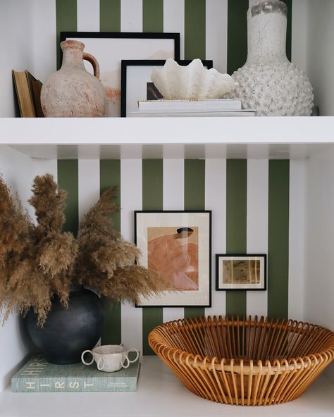 Progress on adding stripes to our living room shelves! 🙌🏼 swipe to see the before and ideas I have for other changes to work on to make it more cohesive. This has been such a fun project that added an interesting detail to our otherwise neutral living space (and for under $15 👏🏼) I used peel and stick wallpaper rather than paint since I change my mind so often. Will share a video of the process soon with details and a look at the whole room! Change My Mind, Living Room Shelves, Room Shelves, Stick Wallpaper, Peel And Stick Wallpaper, Fun Projects, My Mind, A Video, Living Spaces