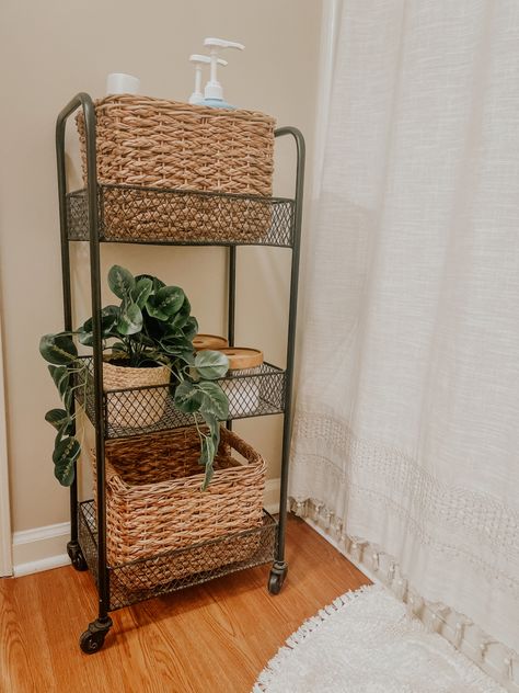 Bathroom organization with baskets and plant from target Wicker Bathroom Decor, Bathroom Cart Organization, Bathroom Cart Ideas, Single Wide Mobile Home Decorating, Small Restroom, Bedroom Decor Fall, Bathroom Storage Caddy, Academia Home Decor, Wicker Bathroom