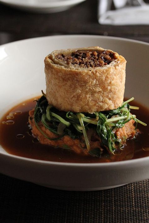 An elegant vegan version of a traditional Wellington! Puff pastry stuffed with portobello, pecans and sage, on a bed of sweet potatoes, and mushroom jus Portobello Wellington, Dinner Thanksgiving, Vegan Thanksgiving, Vegan Christmas, Fancy Dinner, Portobello, Vegan Dishes, Base Foods, Vegan Dinners