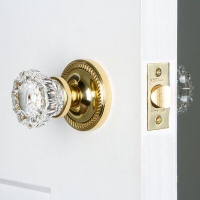 Blending rich detail and subdued refinement, the Passage Door Knob with Rope Rosette captures a style that has been a favorite for centuries. Add Nostalgic Warehouse crystal door knob, with its smooth center flawlessly flowing into fluted edges, for a striking match. All Nostalgic Warehouse door knobs are mounted on a solid (not plated) forged brass base for durability and beauty. Backset: 2-3/8", Finish: Polished Brass | Nostalgic Warehouse Clear Crystal Passage Door Knob w / Rope Rosette in Ye Brass Interior Door Hardware, Boho Door Knobs, Barndominium Bathroom, Crystal Front Door Knob, Champagne Brass Door Knobs, Door Knobs Interior, Bedroom Door Knobs, Cristal Door Knob, Crystal Brass Door Knobs