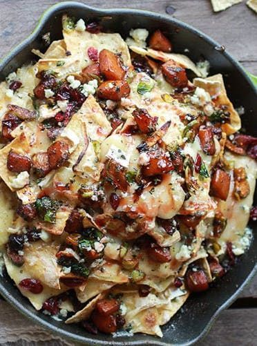 Cranberry, Butternut and Brussels Sprout Brie Skillet Nachos. Get this and more delicious Thanksgiving recipes all your guests will love here. #thanksgivingrecipes #thanksgiving #thanksgivingappetizers #appetizerrecipes #nachos Hor Devours, Skillet Nachos, Best Thanksgiving Appetizers, Thanksgiving Appetizers Easy, Thanksgiving Appetizer Recipes, Fontina Cheese, Brussels Sprout, Delicious Thanksgiving, Superbowl Snacks