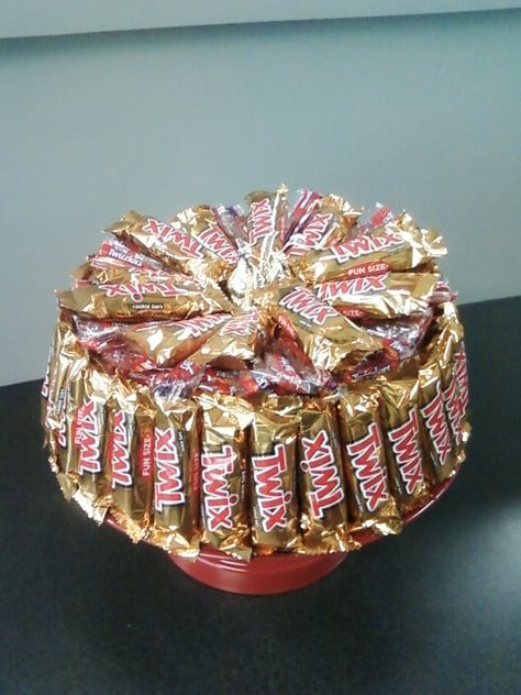 Twix and twizzlers candy cake Twix Cake Birthday, Twix Candy Gift Ideas, Diy Candy Cake Tower, Twizzler Bouquet, Twix Candy Birthday Cakes, How To Make A Candy Cake Tower, Twix Cake, Twix Candy, Black Haircut