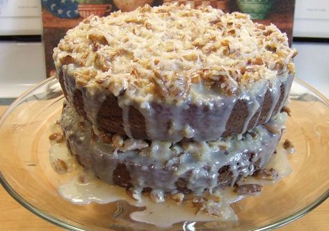 Deadly Coconut Pecan Frosting -- butter, sweeten condensed milk, egg yolk plus coconut & pecans for this version which note:  runs down the side of cake (unlike other versions)... Sweetened Condensed Milk Desserts, Cake With Frosting, Sweetened Condensed Milk Recipes, Chocolate Cake Frosting, German Chocolate Cake Recipe, Pecan Frosting, Coconut Icing, Coconut Pecan Frosting, Milk Dessert